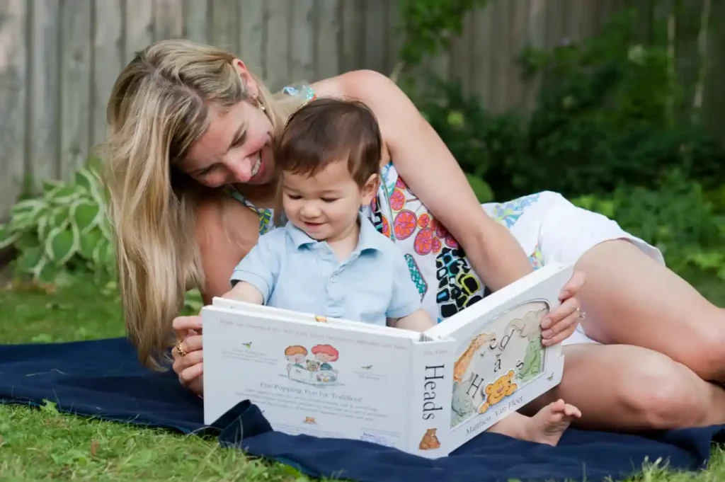 Mother and child read book together